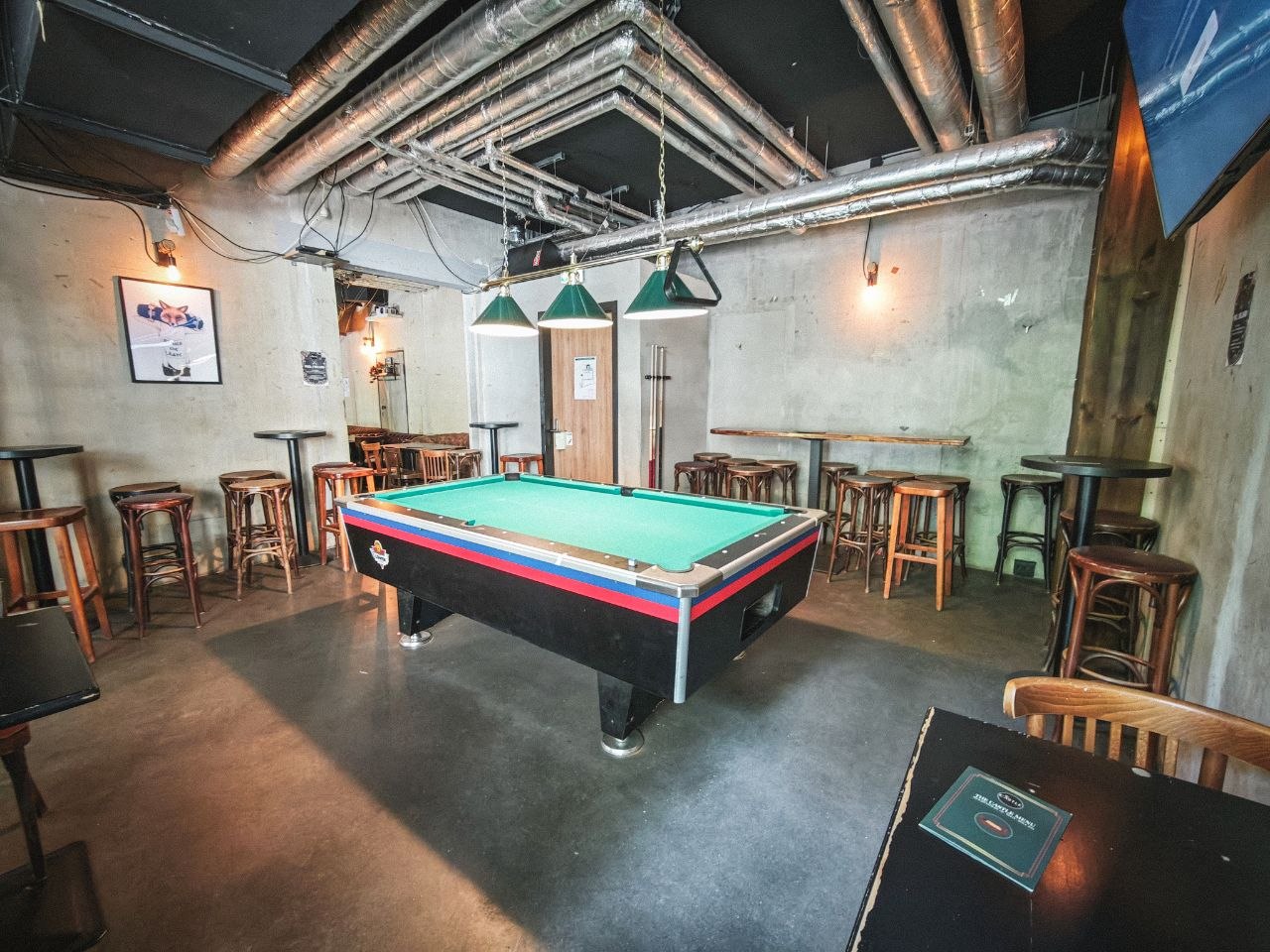 The Back Room at The CASTLE Pub, with a pool table and seating for a private gathering